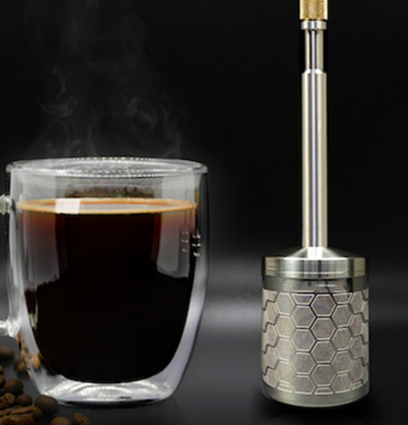 brew wand next to hot cup of coffee